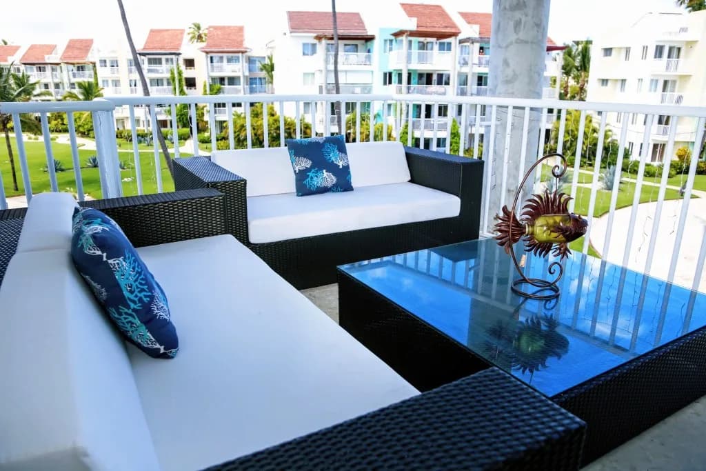 Outdoor deck with ocean view at Playa Turquesa K304
